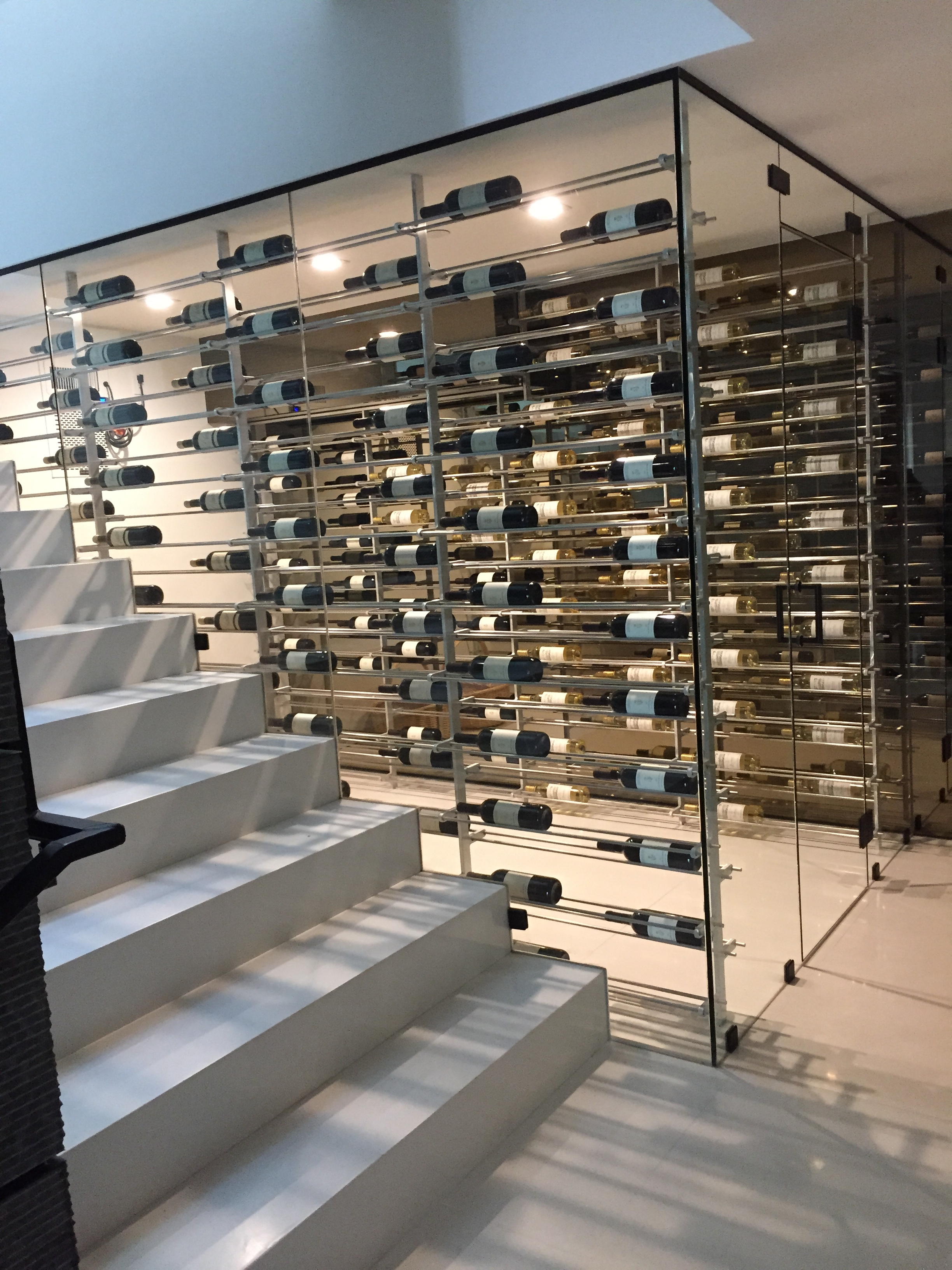Glass wine cellar enclosure installed by DC Glass